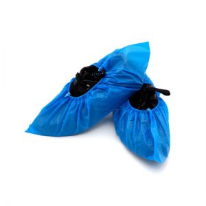 Blue plastic shoe cover, cpe shoe cover, non woven shoe cover covering a pair of black shoes