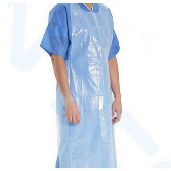 A man standing wearing white translucent colour sleeveless plastic apron on top of a blue scrubs set